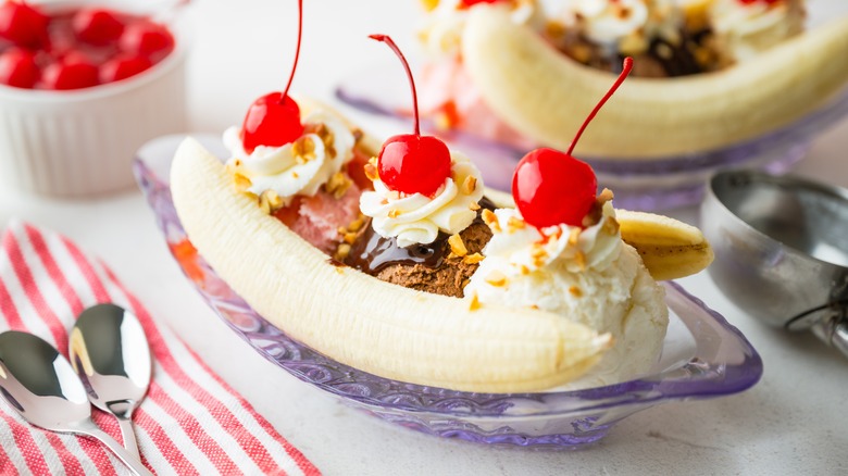 A classic banana split in a glass dish