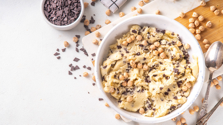 White ceramic bowl full of chocolate chickpea cookie dough