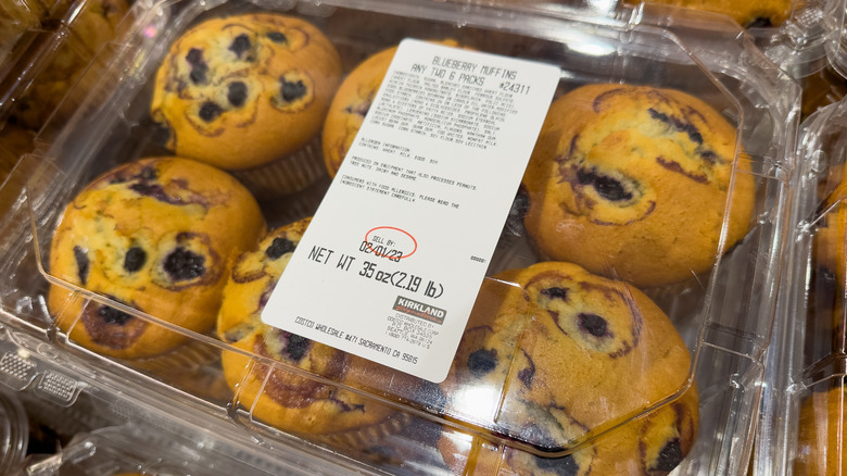 Closeup of a package of blueberry muffins with a sell by date circled in red