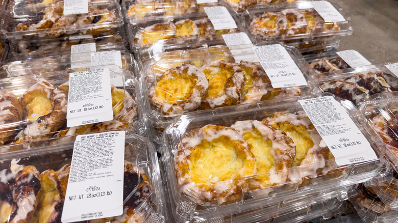 A table is filled with pastries at a Costco bakery