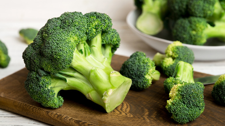 Fresh broccoli on a wooden cutting board