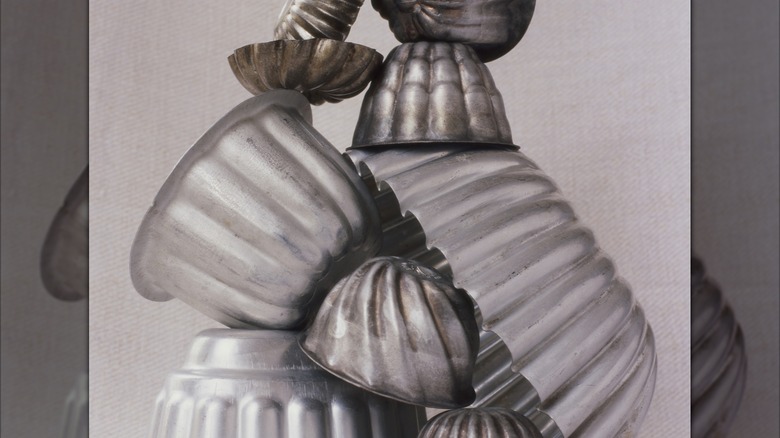 A pile of metals jello molds