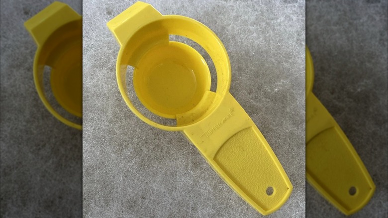 Yellow tupperware egg separator
