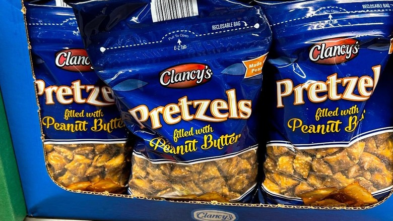 Bags of Clancy's Peanut Butter Filled Pretzel Pieces on an Aldi shelf