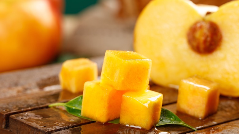 Close up photo of cubed peaches for skewers