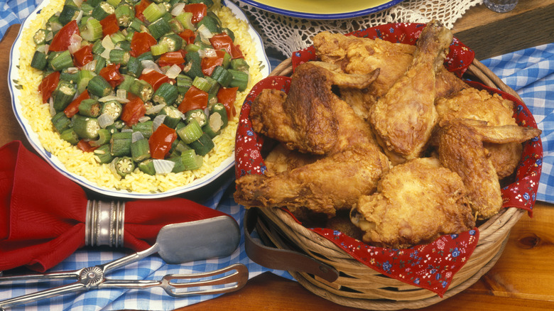 Fried chicken in a basket with a picnic blanket