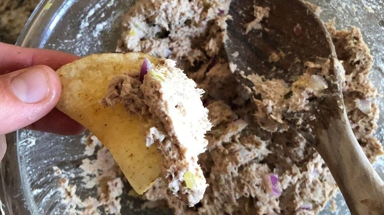 Steak salad in a bowl with a tortilla chip