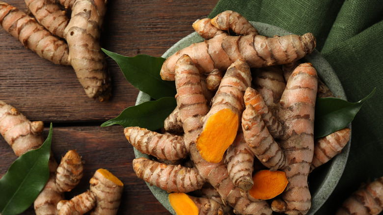 Turmeric roots on a wooden table