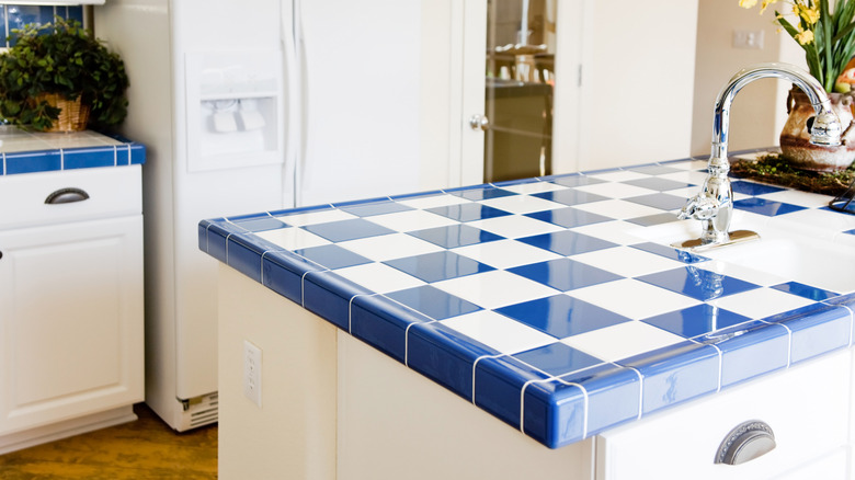 Blue and white tile countertops in a kitchen