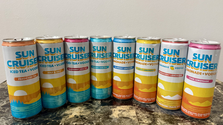 Cans of Sun Cruiser ready to drink cocktails in an arc