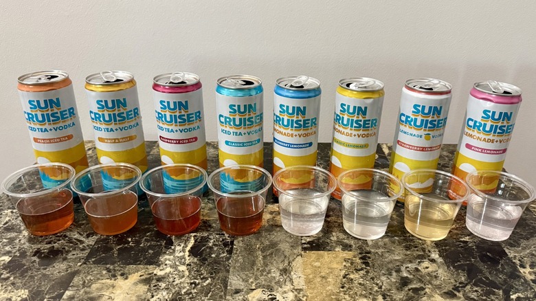 Cans of Sun Cruiser cocktails with samples poured in clear cups