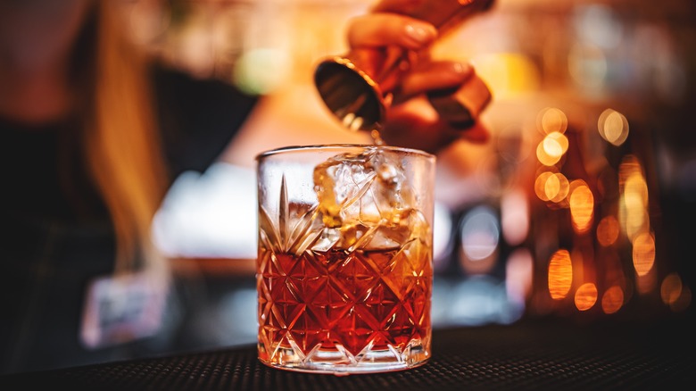 Cocktail with vermouth and lemon twist