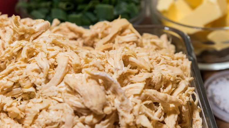 A large tray of shredded chicken
