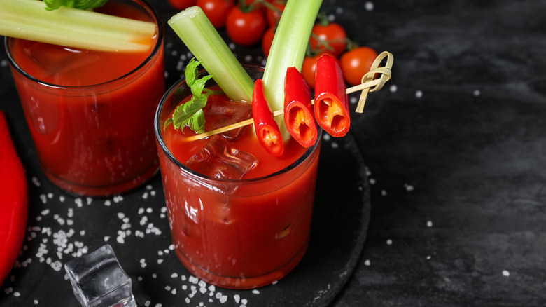 bloody mary with celery and pepper garnishes