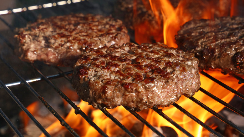 burgers on a flame grill