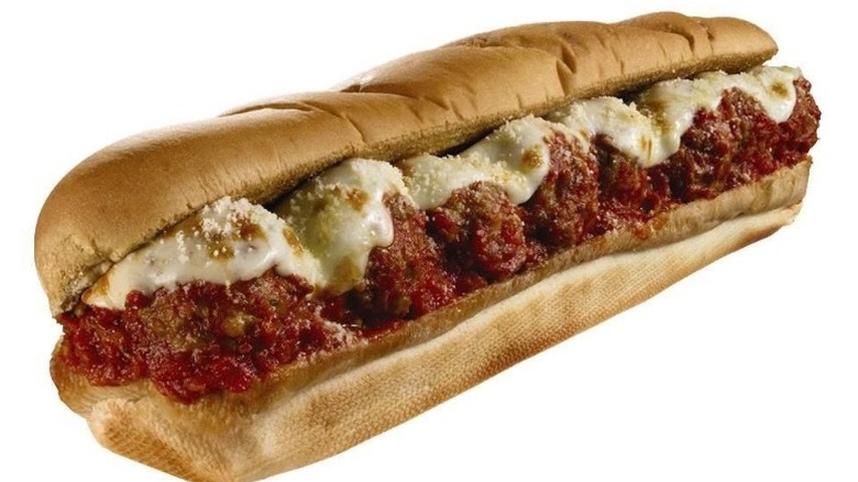 A large meatball sub from Subway sits against a white background