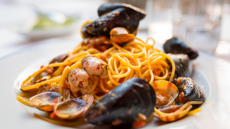 Closeup of a plate of clams, mussels, and pasta