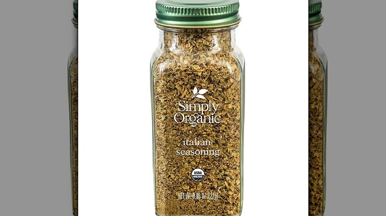 A bottle of Simply Organic Italian Seasoning against a white background