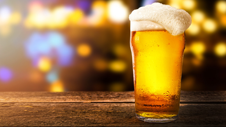 A glass of light beer on a table