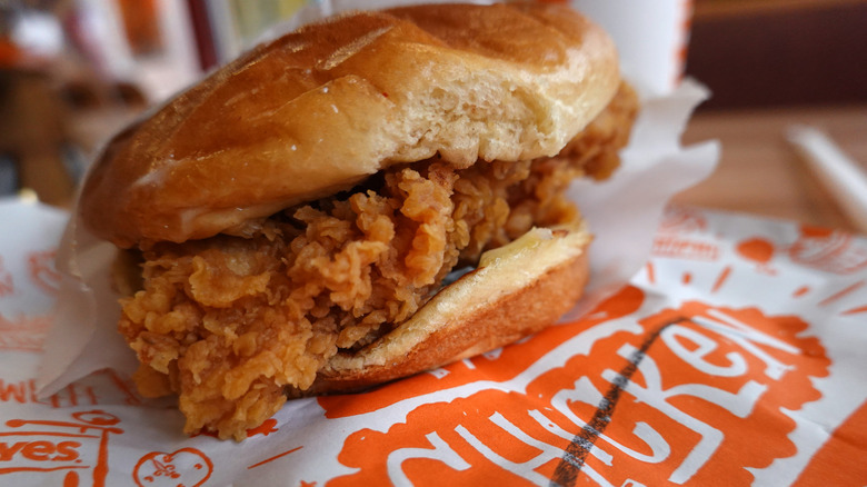 Closeup of a Popeyes' chicken sandwich