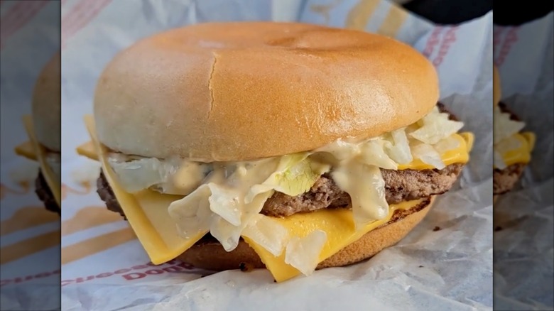 A popular hack of Big Mac sauce on a double cheeseburger at McDonald's is displayed against a paper wrapper