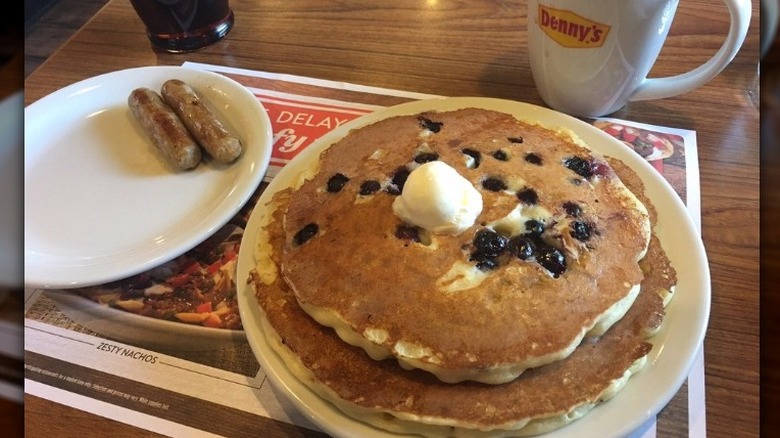 A plate of blueberry pancakes and sausage at Denny's
