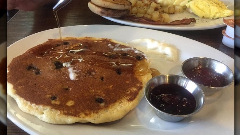 A blueberry pancake and syrups at First Watch