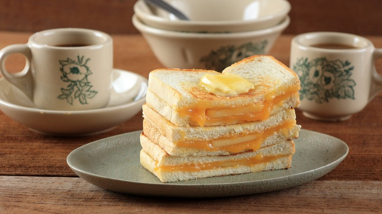 Kaya toast on a plate with mugs