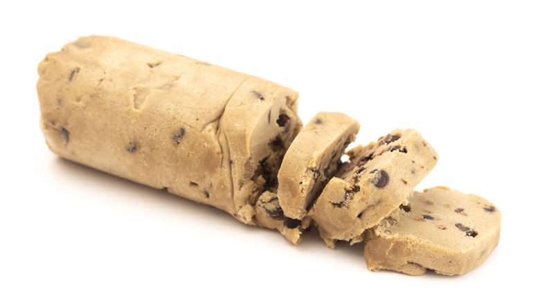 A chilled log of chocolate chip cookie dough