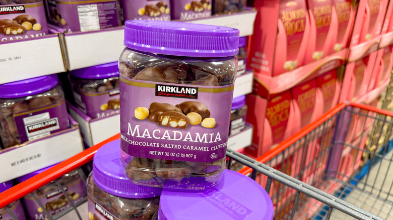 Jars of Costco Macadamia Clusters sit in a Costco buggy