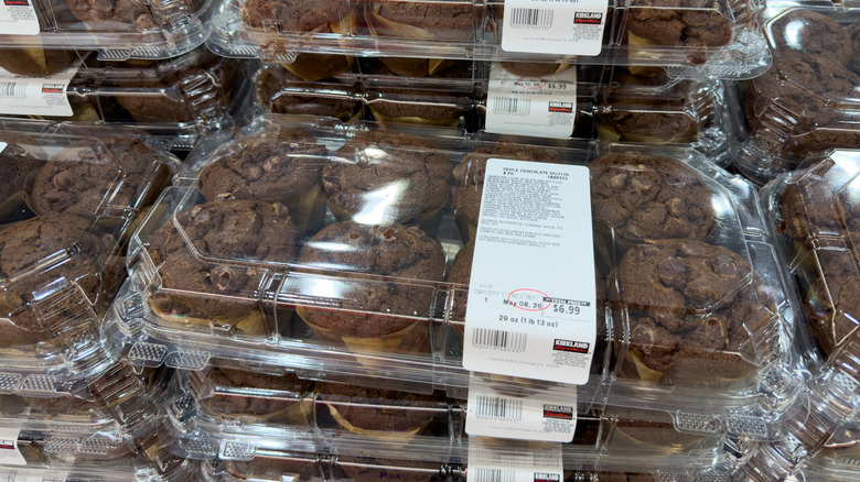 Packages of Costco Triple Chocolate Muffins are stacked together