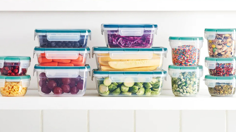 Snapware 38-piece food storage set filled with sliced fruit, berries, snacks, and dry goods in clear containers with snap-lock lids.