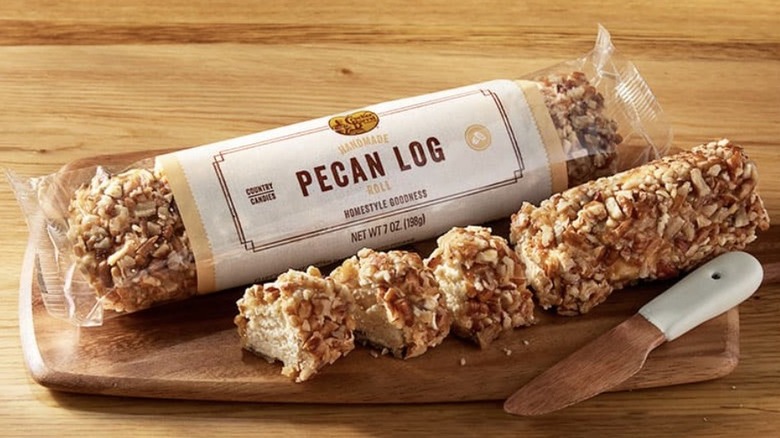 Packaged Pecan Log beside an open one cut into pieces