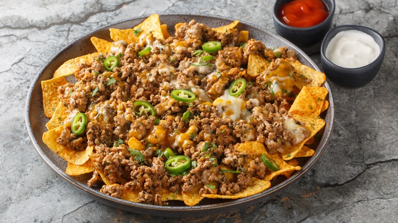 Nachos with ground beef, cheese, and jalapeños