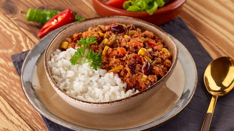 Ground beef rice bowl with corn, tomatoes, and beans