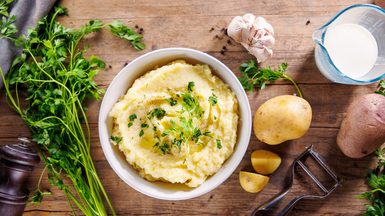 Mashed Potatoes with Ingredients on Wooden Background Comfort Food Preparation