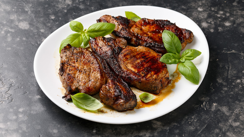 Grilled Pork Loin steaks in a white plate.
