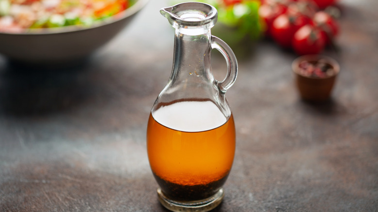 Italian vinaigrette sauce in bottle for sauces. Homemade salad dressing