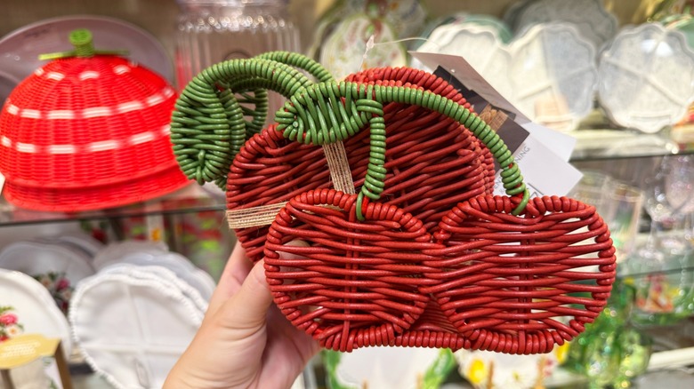 A pack of wicker cherry-shaped coasters with a holder
