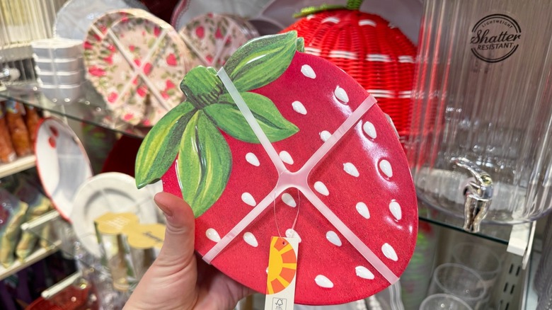 A set of four melamine strawberry-shaped plates