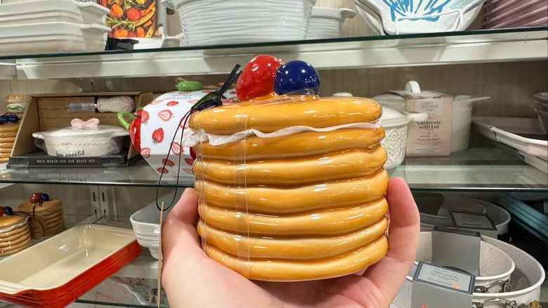 A stoneware canister shaped like a stack of pancakes