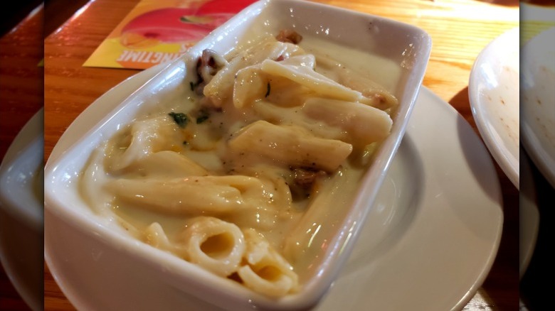 A plate of Applebee's pasta sits on a table in the restaurant