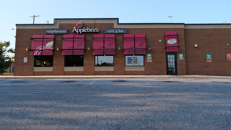 Applebee's with bare parking lot in foreground