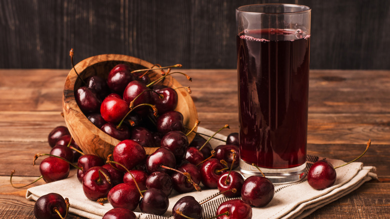 Cherry juice surrounded by cherries.