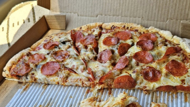 Half a large pepperoni pizza from Casey's sitting in a box.