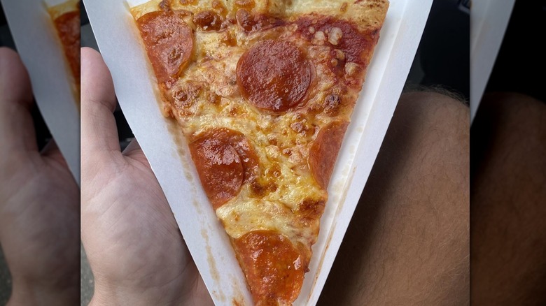 Single slice of pepperoni pizza from Fastrac sitting in a paper tray.