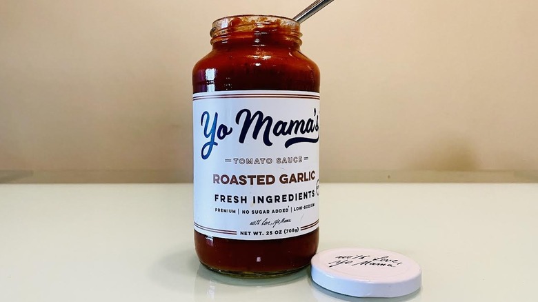 Open jar of Yo Mama's Foods Roasted Garlic Marinara Sauce