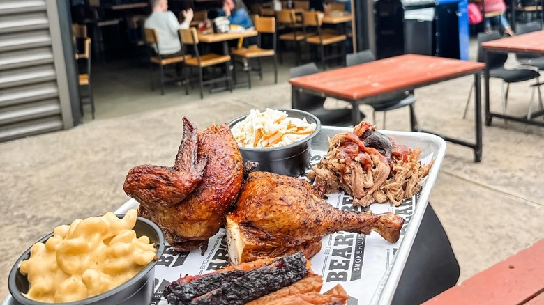 A tray of barbecue, different meats and sides