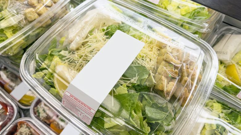 Containers of pre-packaged Caesar salad