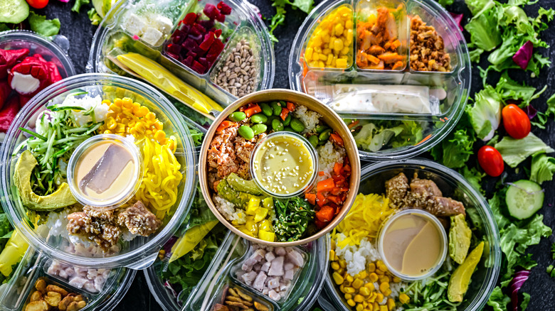 Overhead view of assorted pre-packaged salads and bowls